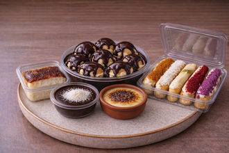 Premium Tatlı Şöleni (1 Kg İmza Profiterol, 10 Adet Karışık Ekler, 1 Adet Seçeceğiniz Sütlü Tatlı) görseli