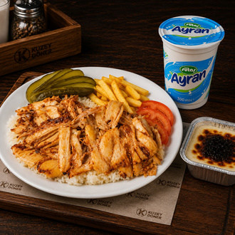1 Porsiyon Pilav Üstü Tavuk Döner Menü (275 Ml Ayran + Fırın Sütlaç) görseli